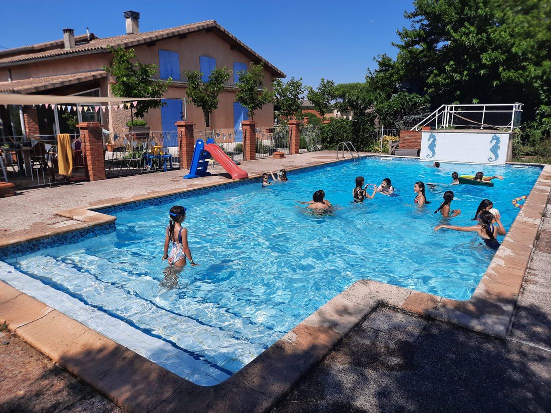 The family pool and garden, with the house in the background